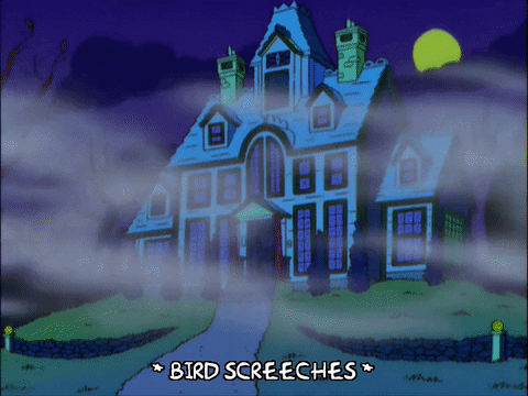 Homer Simpson perto de uma casa assustadora